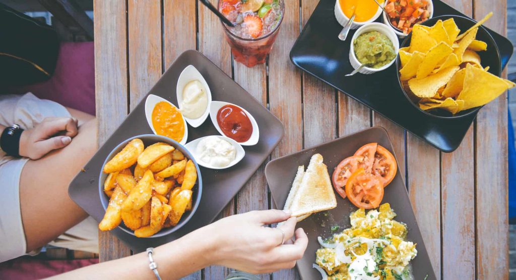 A person is eating food on the table