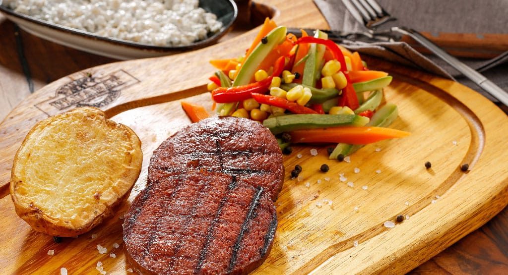A steak and vegetables on the table